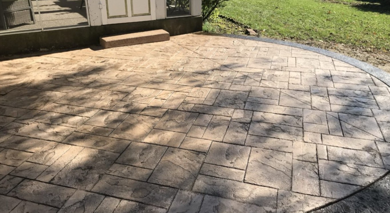 Stamped decorative concrete patio with herringbone pattern